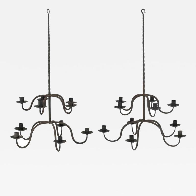 Pair of Early Two Tier Forged Iron Chandeliers