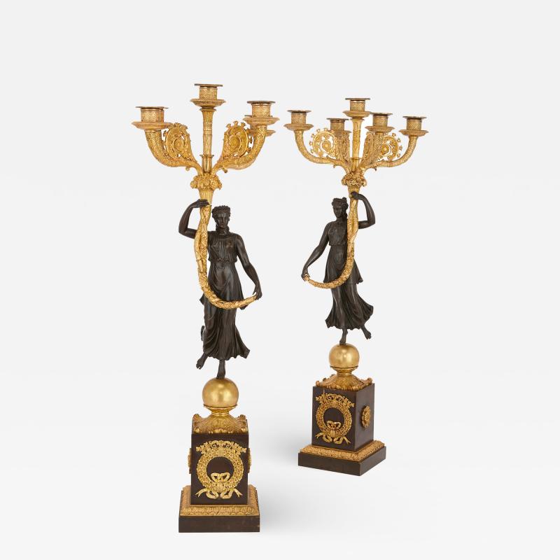 Pair of Empire period gilt and patinated bronze candelabra