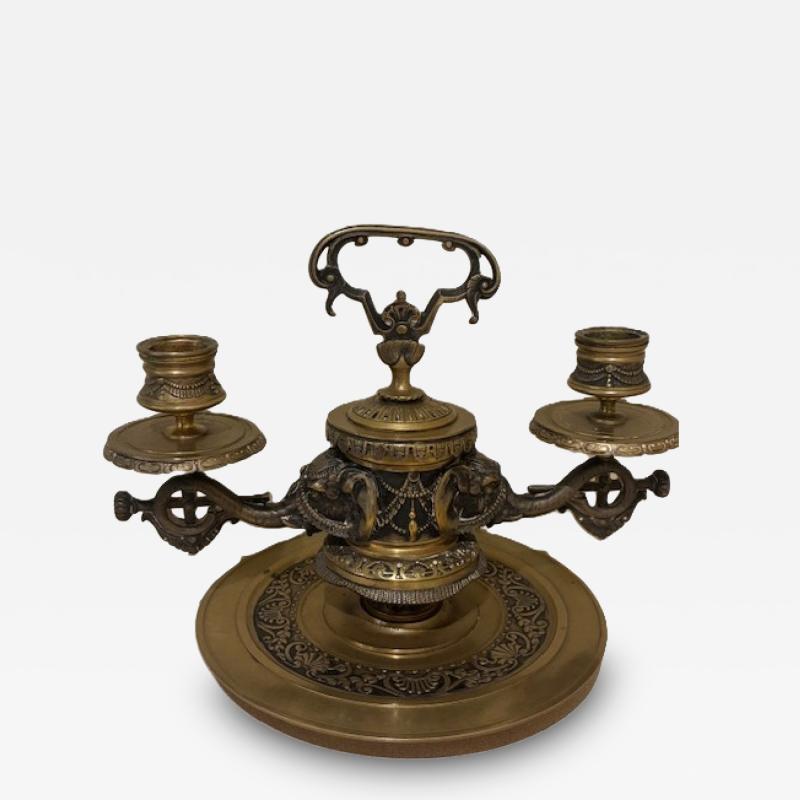 Pair of English Regency bronze candlesticks with 2 elephant heads arms