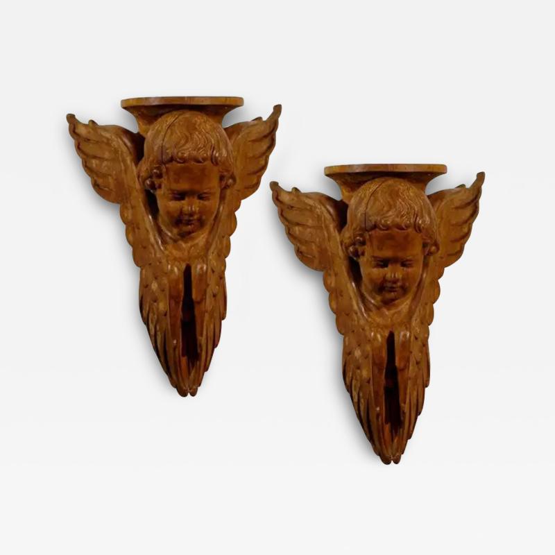 Pair of French 19th Century Wooden Wall Brackets with Carved Cherubs