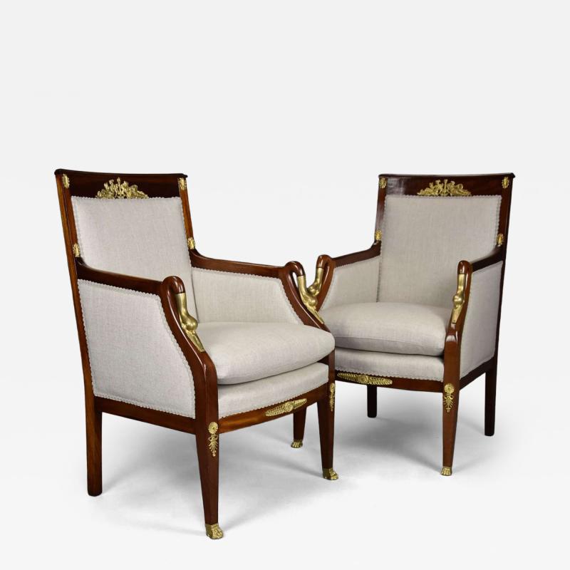 Pair of French Empire style mahogany upholstered armchairs