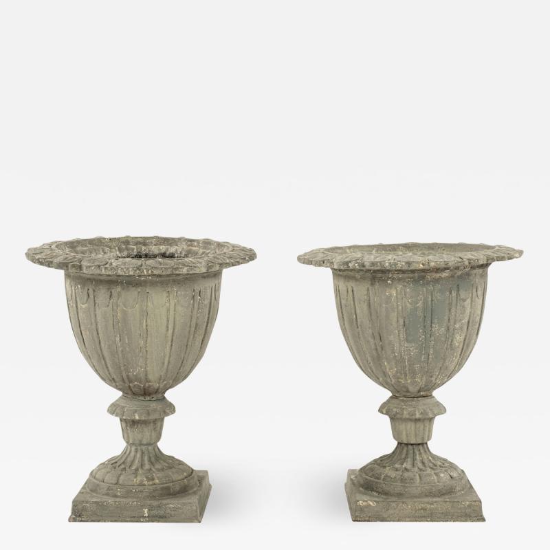 Pair of French Gray Painted Cast Iron Garden Urns