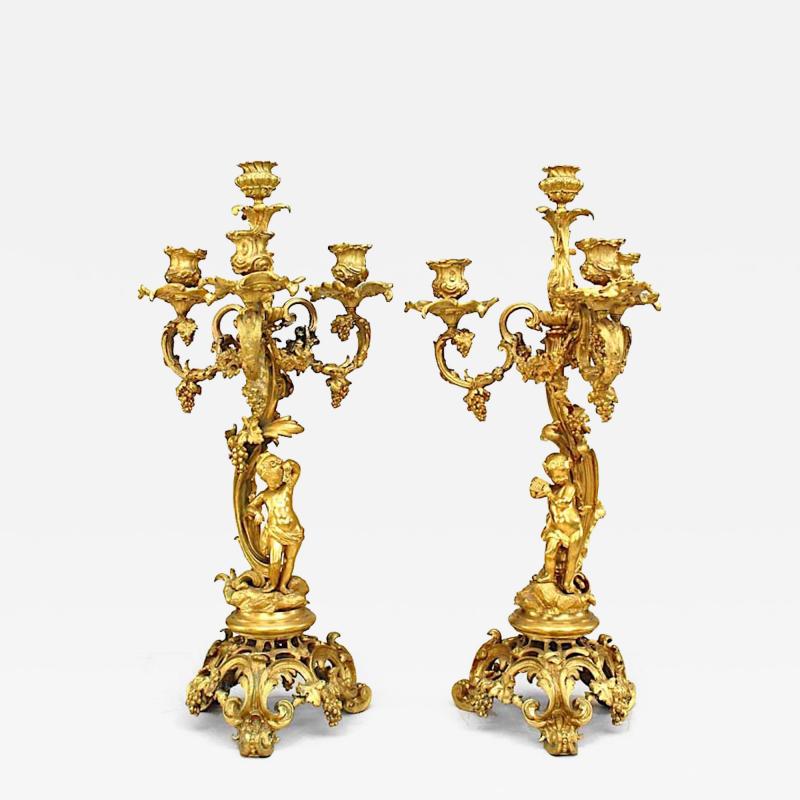 Pair of French Louis XV Style Bronze Dore Four Arm Cupid Candelabras