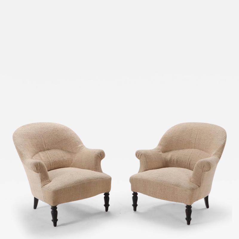Pair of French Napoleon III Lounge chairs C 1870 on ebonized turned feet 