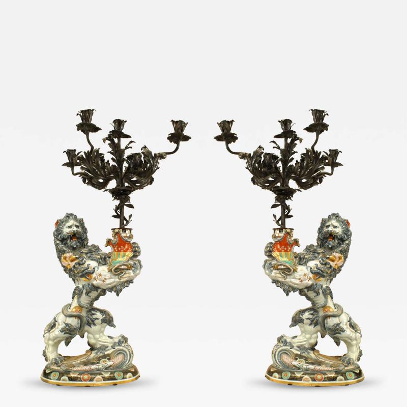 Pair of French Porcelain Lions Holding Wrought Iron Candelabras