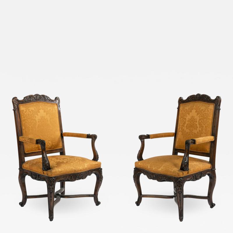 Pair of French Regence Gold Arm Chairs