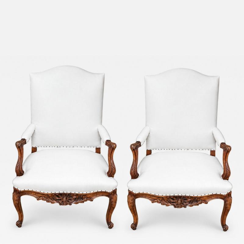 Pair of French Regence Style Armchairs in carved Walnut 19th Century