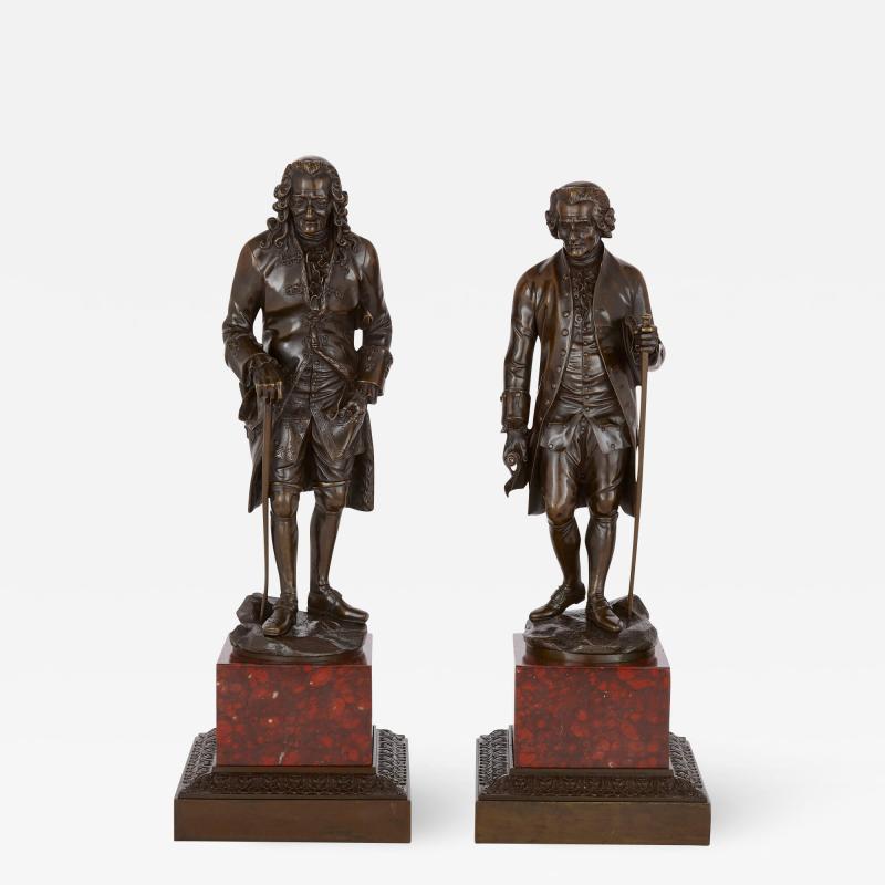 Pair of French patinated bronze sculptures of Voltaire and Rousseau