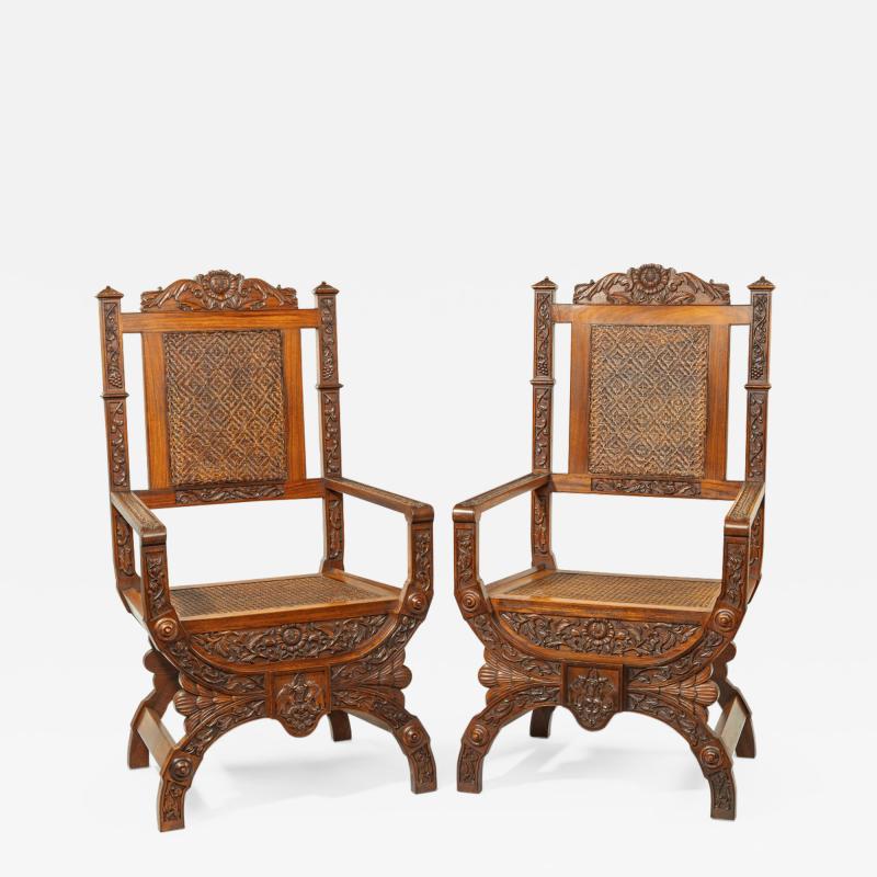 Pair of Indian throne chairs carved with the arms of the Kingdom of Travancore