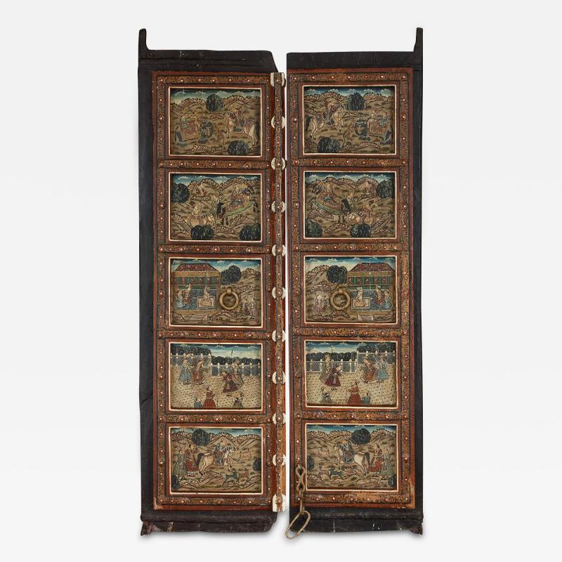 Pair of Indian wooden doors with painted decoration