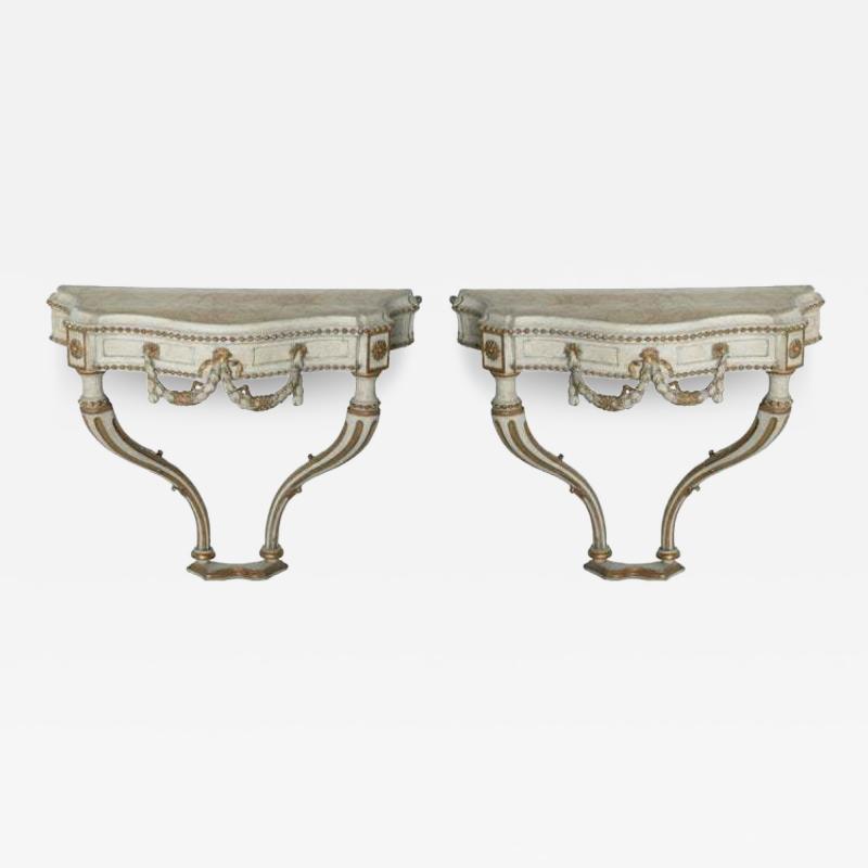 Pair of Italian Cream Painted Parcel Gilt and Carved Wall Mounted Console Tables