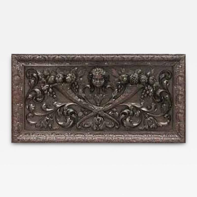 Pair of Italian Renaissance style carved walnut wall plaques with cupid head