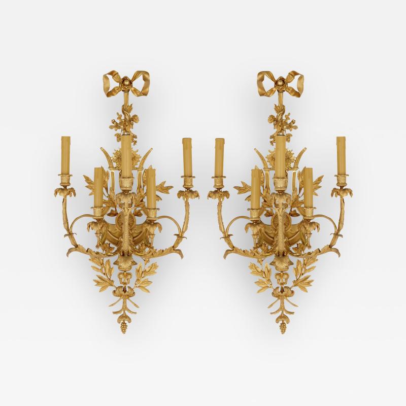 Pair of Louis XVI style gilt bronze sconces