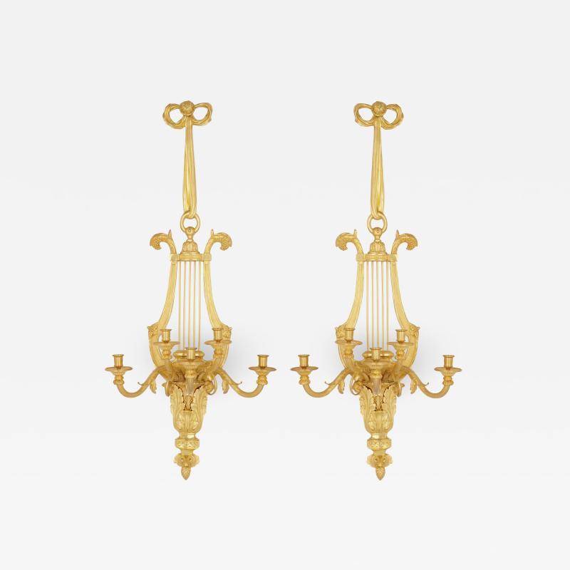 Pair of Louis XVI style gilt bronze sconces