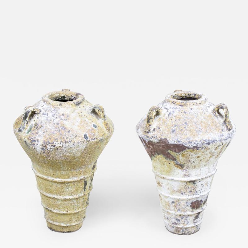 Pair of Outdoor Cast Iron Urns with Beige and Brown Patina