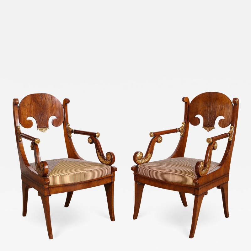 Pair of Russian Neoclassical Parcel Gilt Mahogany Armchairs