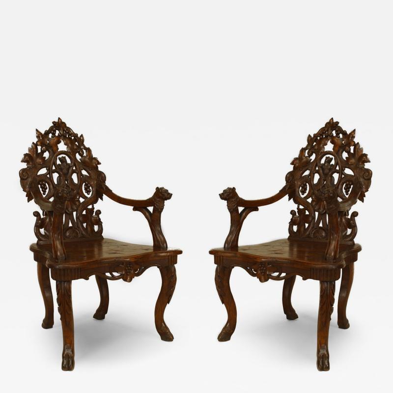Pair of Rustic Black Forest Carved Walnut Armchairs