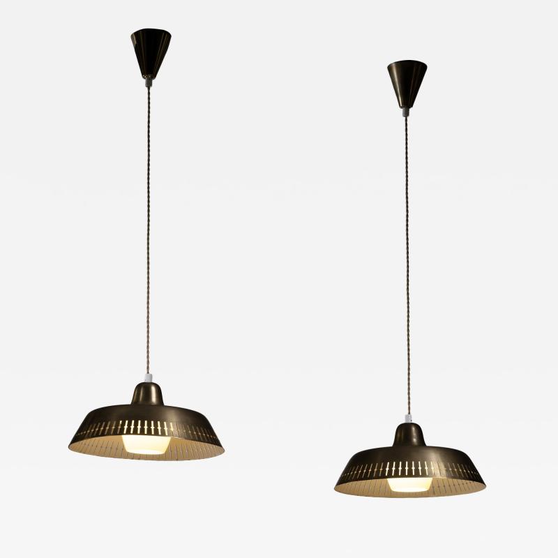 Pair of Scandinavian Modern brass pendants