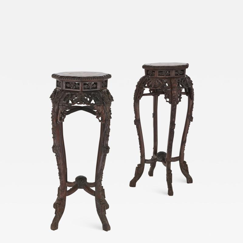 Pair of antique Chinese hardwood and veined marble stands