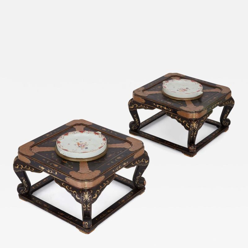 Pair of antique Chinese lacquered low tables with porcelain warming plates