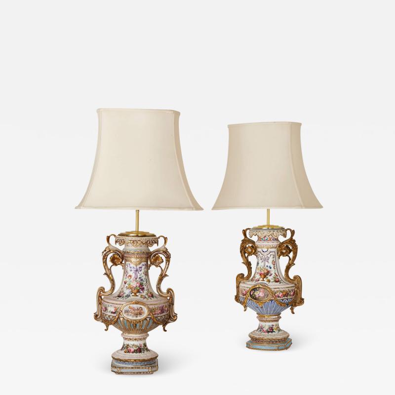 Pair of antique florally decorated porcelain lamps