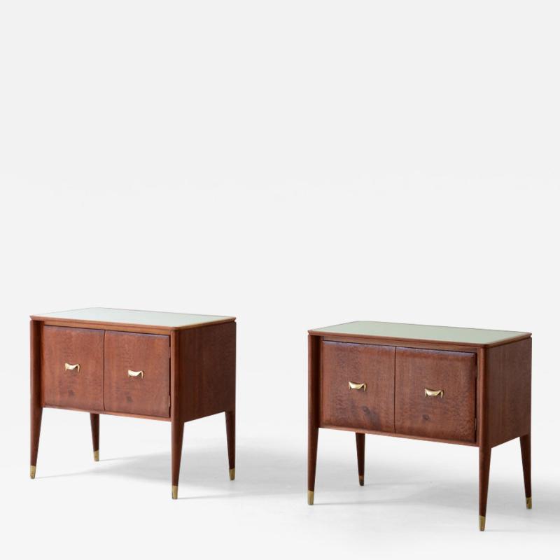 Pair of bedside tables with tapered legs brass tips and handles 