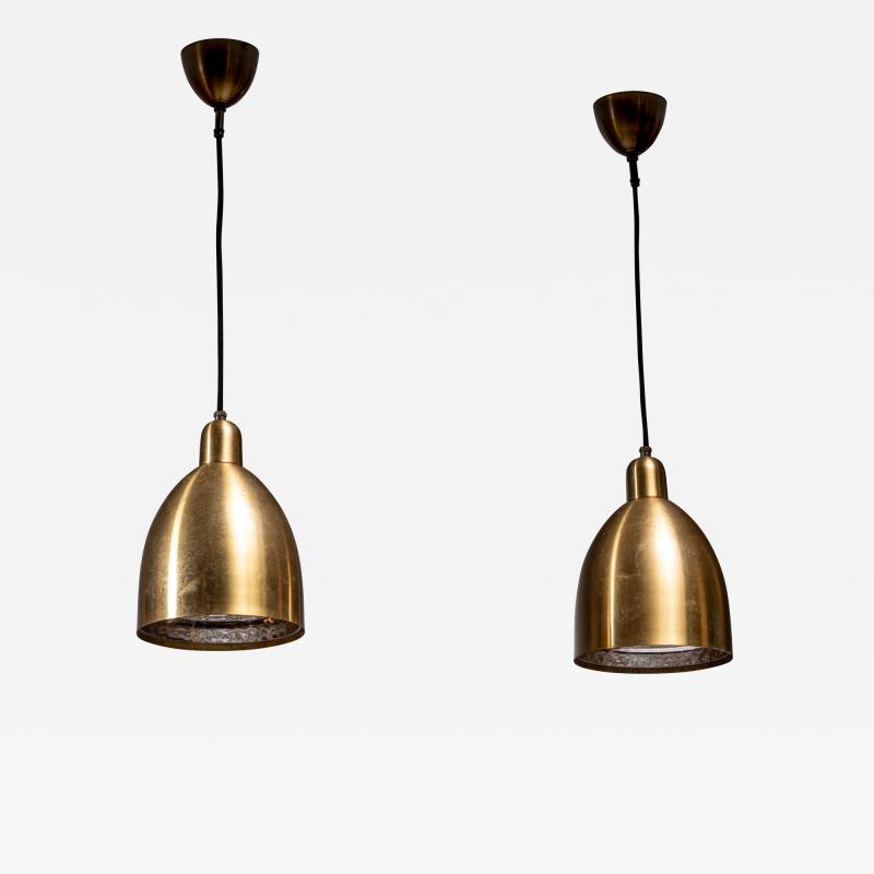 Pair of brass pendant lamps