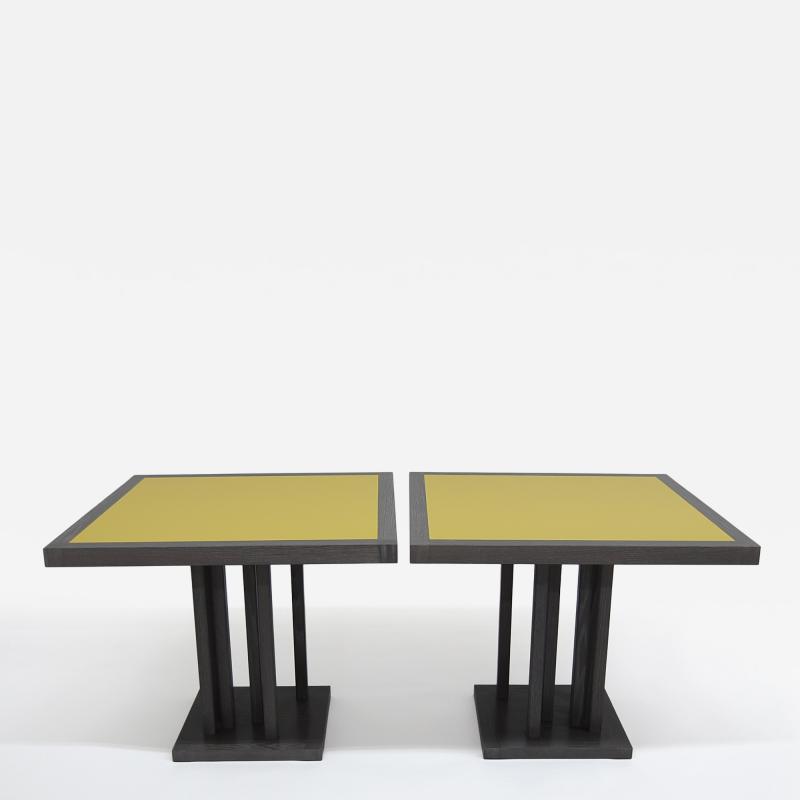Pair of cerused oak dining tables with yellow lacquered top