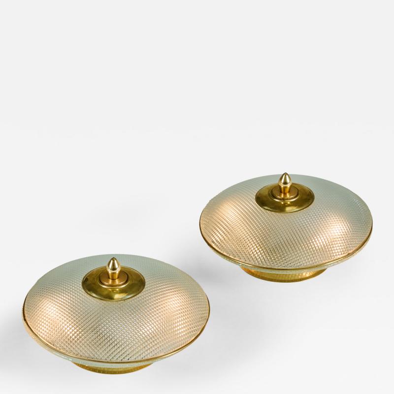 Pair of domed glass table lamps with brass base frame and decorative filial