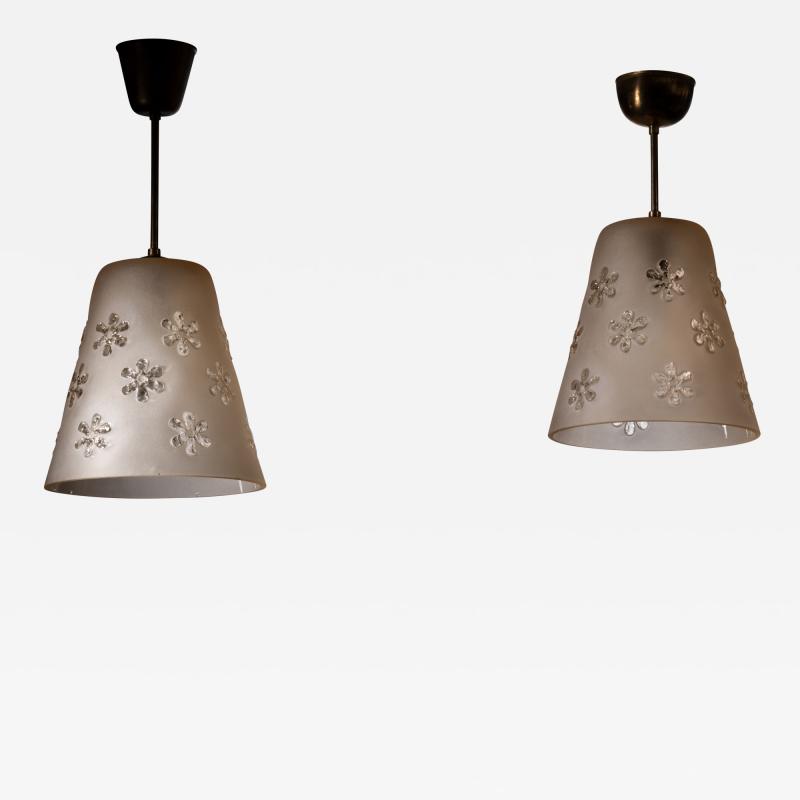 Pair of frosted glass pendant with flower motifs
