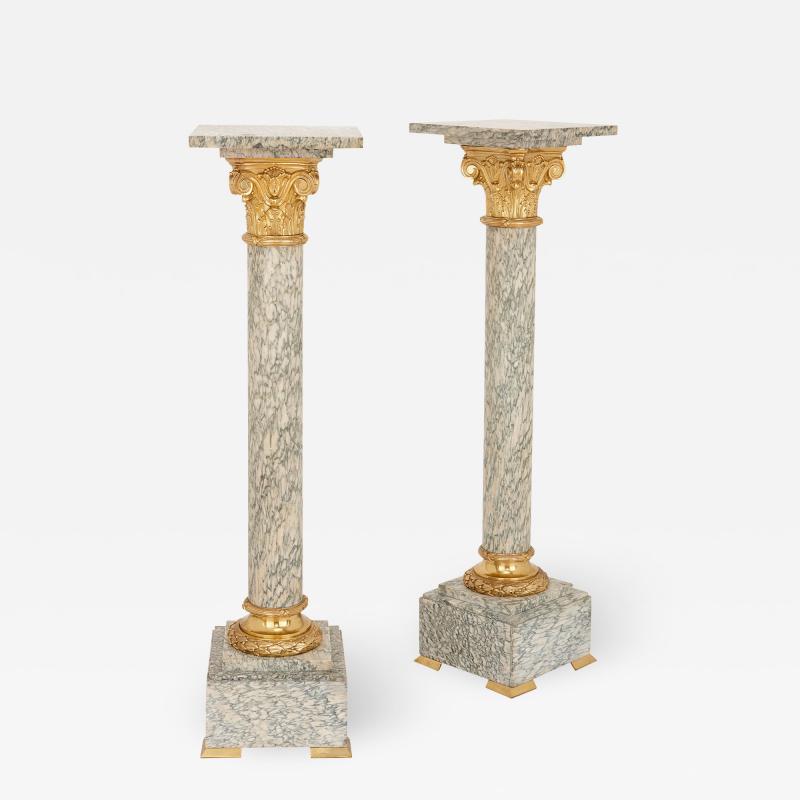 Pair of gilt bronze and marble columns in the Neoclassical style