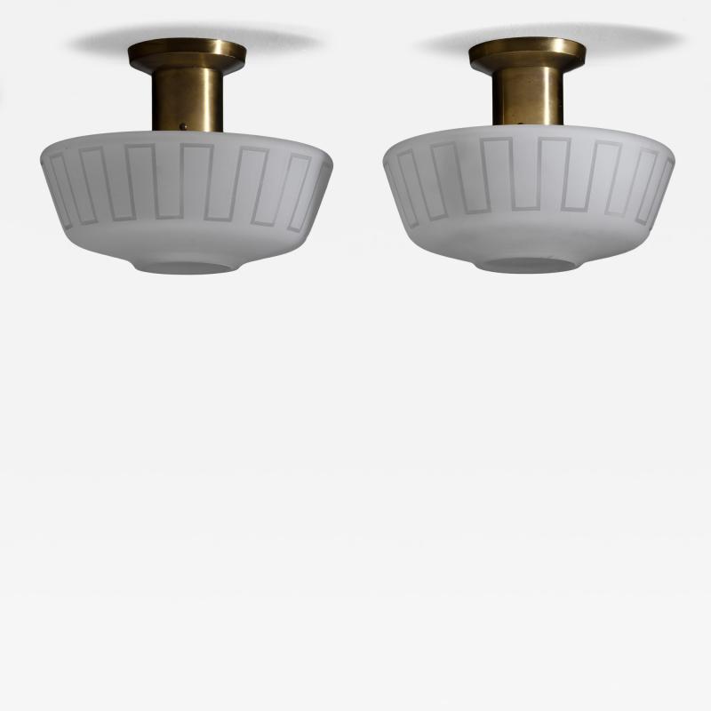 Pair of glass and brass ceiling lamps