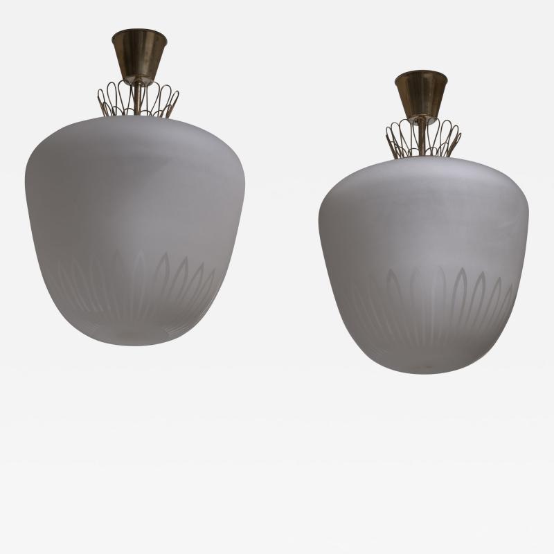 Pair of large frosted glass and brass pendants