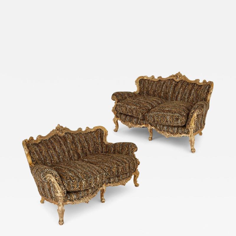 Pair of large ornate giltwood antique sofas