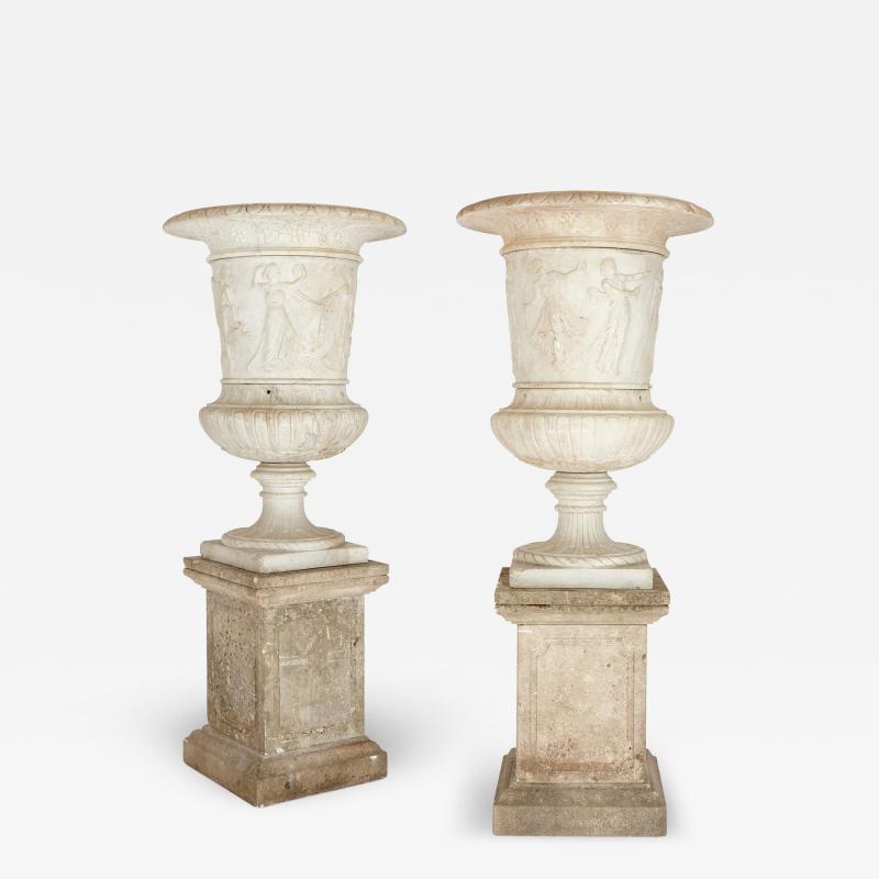 Pair of large very fine carved marble garden urns of campana form with plinths