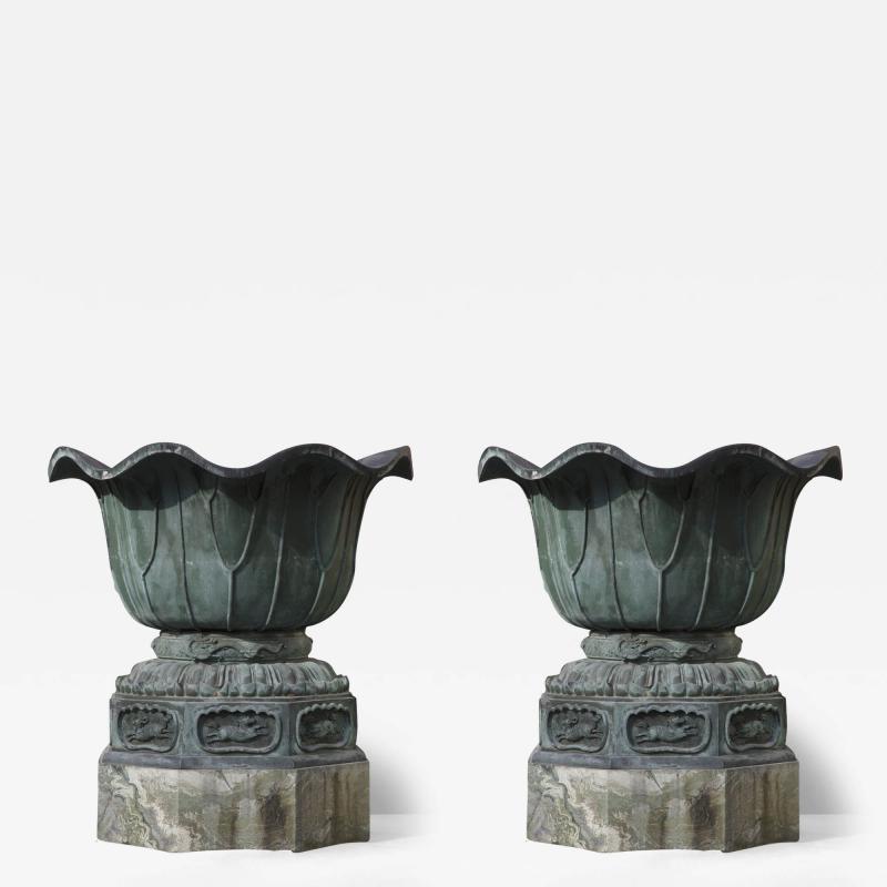 Pair of massive patinated bronze Li n flower form vases