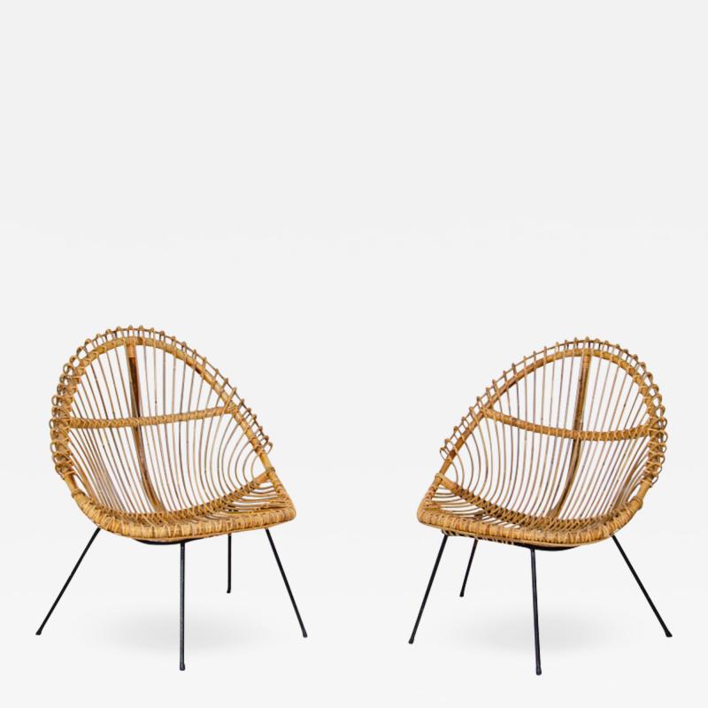 Pair of nice curved rattan chairs with metal legs Italy1950s