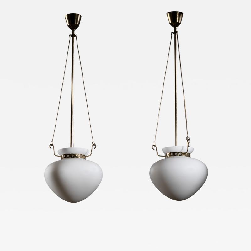 Pair of opaline glass and brass pendants