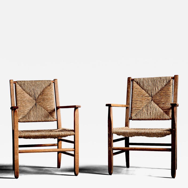 Pair of rustic Oak Lounge Chairs with hand woven Rush Seats