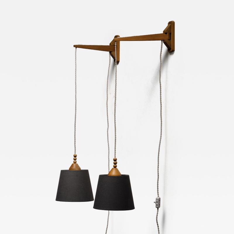 Pair of swiveling wall lamps
