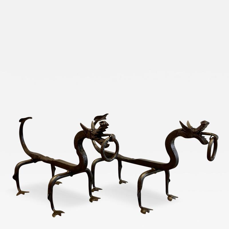 Pair of wrought iron andirons representing dragons