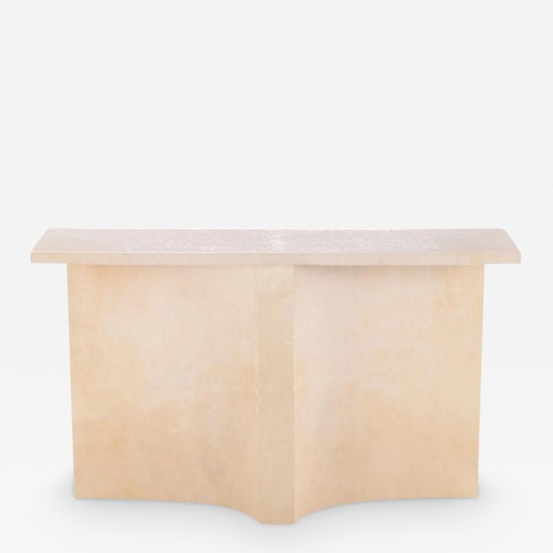 Parchment covered console table having a double concave design base 