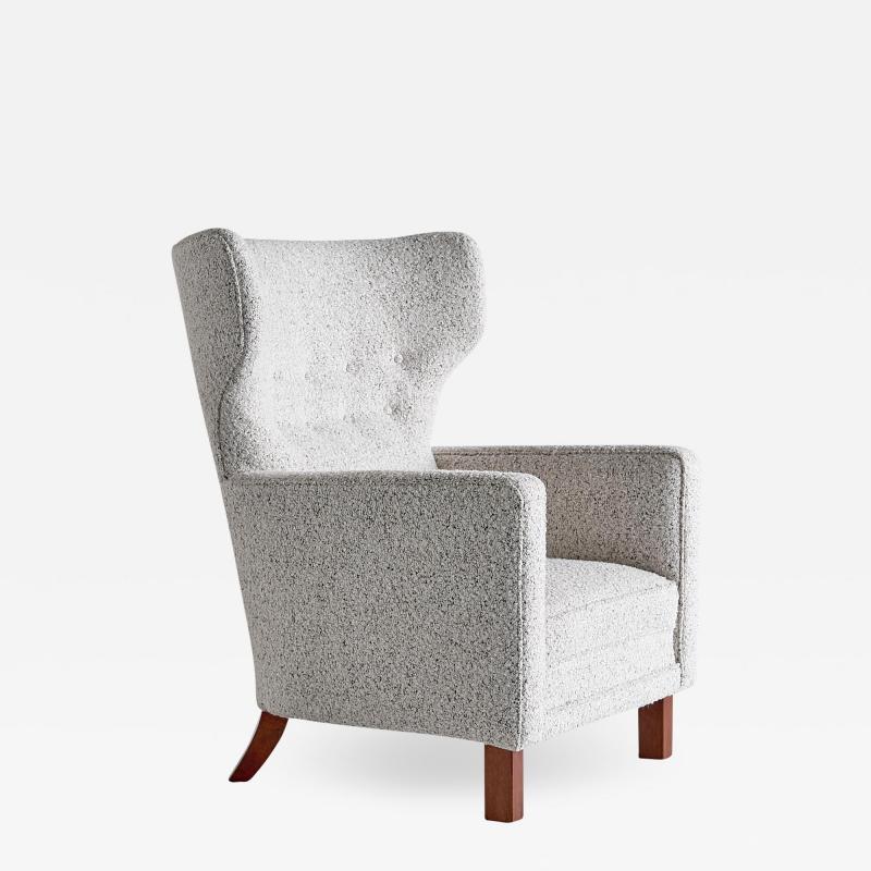 Paul Boman Paul Boman Wingback Chair in Pearl Boucl Fabric and Beech Finland 1940s