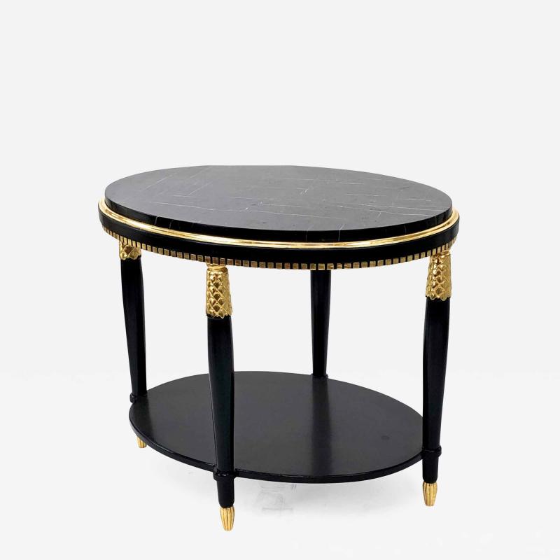 Paul Follot Paul Follow black oval coffee table with pine gold leaf detail and marble top