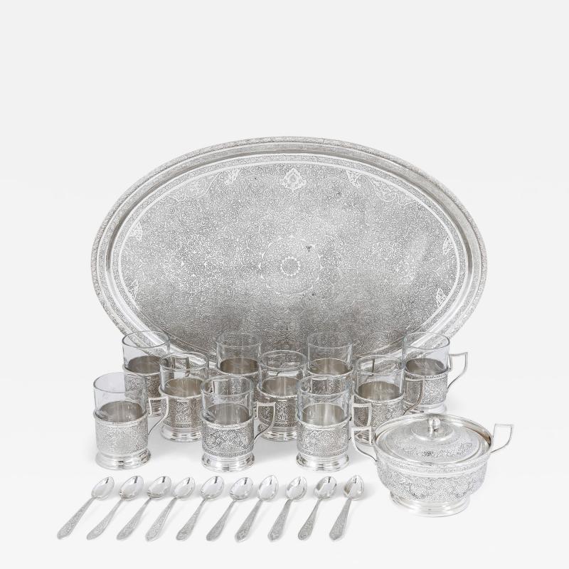 Persian engraved glass and silver part drinks service