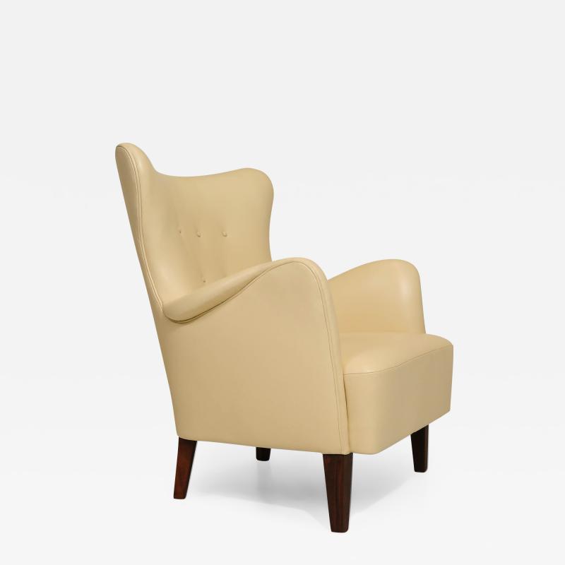 Peter Hvidt Orla M lgaard Nielsen Early Peter Hvidt Lounge Chair in Light Yellow Cream Leather