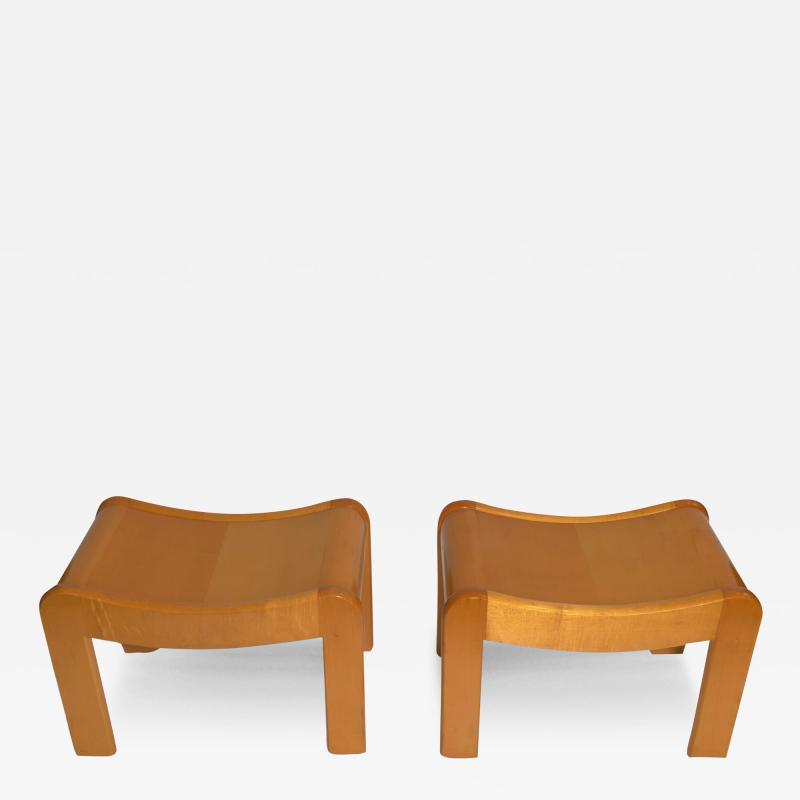 Pierre Chareau Pair of curved stools in sycamore in the style of P Chareau France circa 1990