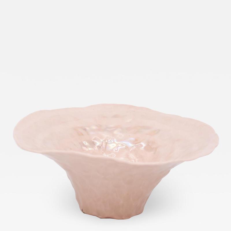 Pink bowl with exaggerated lip and pearl luster accent