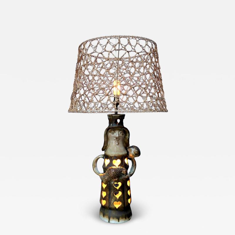 Pottery lamp with heart motif with original string shade