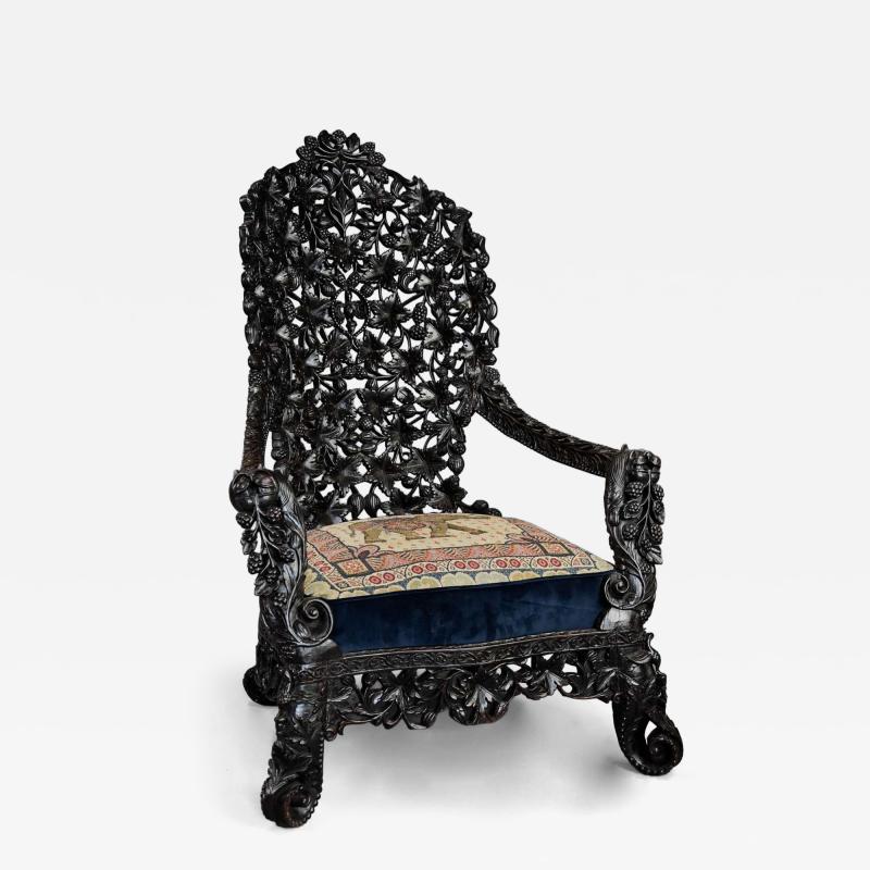 Rare highly decorative profusely carved 19thc Indian armchair